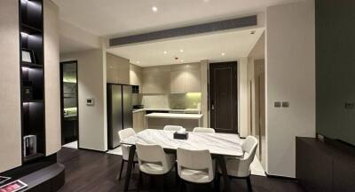 Modern kitchen with integrated dining area featuring sophisticated design