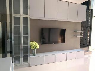 Modern living room with built-in wall unit and sleek design