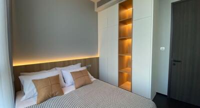 Modern bedroom with stylish lighting and smart storage solutions