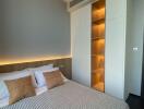 Modern bedroom with stylish lighting and smart storage solutions