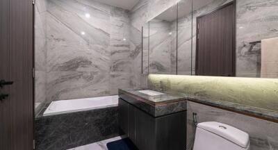 Modern bathroom with marble finish and sleek fixtures