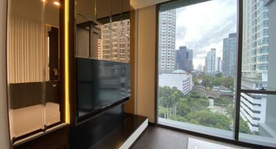 Modern living room with city view through large windows