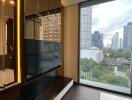 Modern living room with city view through large windows