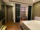 Modern bedroom interior with built-in wardrobes and ambient lighting