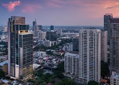 Panoramic view of a bustling city skyline at dusk