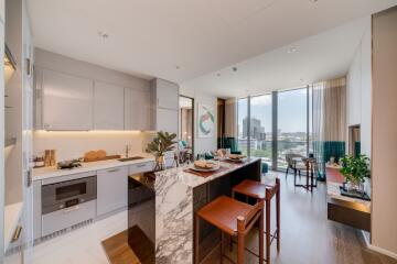 Modern kitchen with dining area and city view