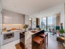 Modern kitchen with dining area and city view