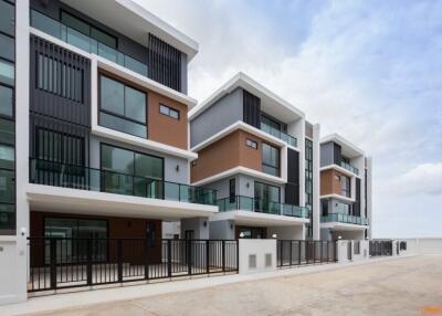Modern townhouses with stylish exterior design and ample parking space