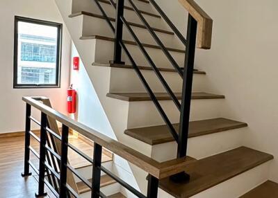 Modern staircase in a residential building with hardwood floors