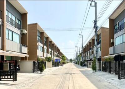 Modern residential townhouse complex with gated entries