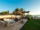 Luxurious beachfront patio with seating and scenic view