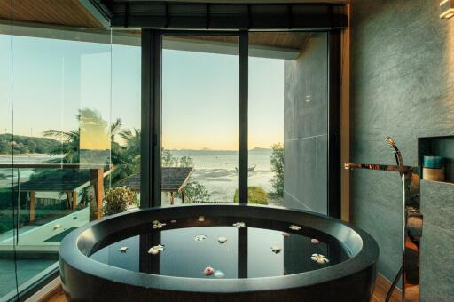 Luxurious bathroom with ocean view and freestanding bathtub