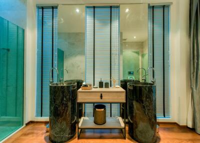 Modern bathroom with dual vessel sinks and stylish decor