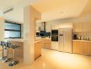 Modern kitchen with breakfast bar and built-in appliances