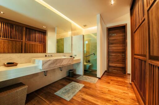 Modern bathroom with elegant wood finishes and ambient lighting