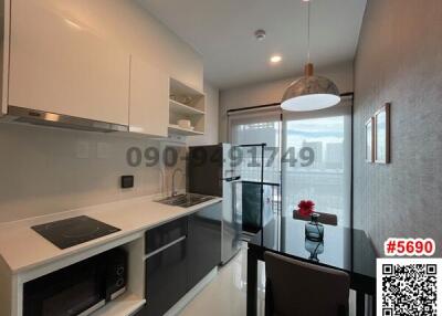 Modern kitchen with sleek design and well-lit interior