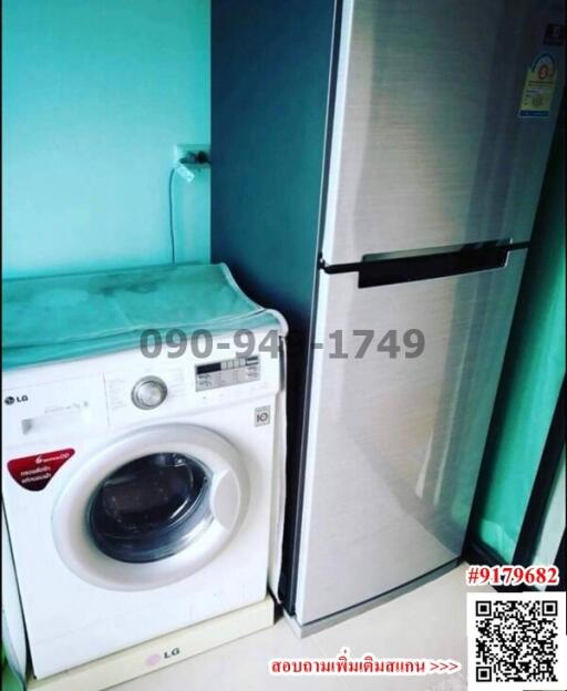 Compact laundry room with modern appliances