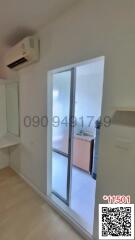 Bright bedroom with large sliding door and air conditioning unit