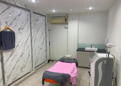Modern treatment room in a medical or wellness facility with professional equipment