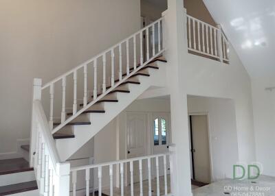 Elegant interior staircase with white and wood finishes