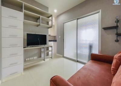 Modern living room with built-in shelves and large TV