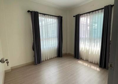 Bright and spacious empty bedroom with large windows