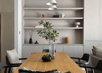 Stylish modern dining room with wooden table and designer chairs