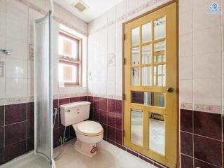 Modern bathroom with shower cabin and elegant tiling