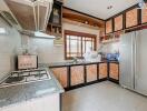 Spacious and well-equipped kitchen with modern appliances and ample storage