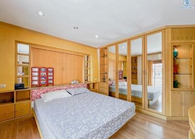 Spacious and well-lit bedroom with ample storage