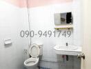 Compact residential bathroom with basic amenities