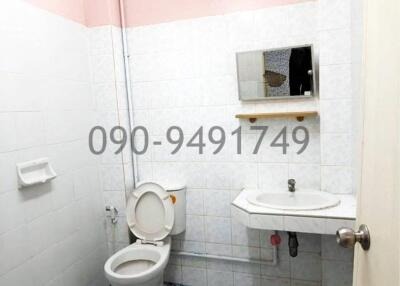 Compact residential bathroom with basic amenities