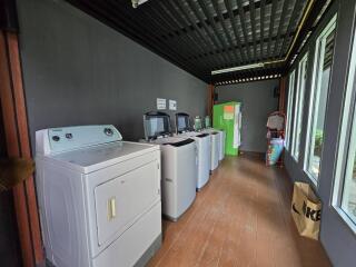 Spacious laundry room with modern appliances and ample natural light