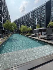 Modern residential building complex with outdoor swimming pool