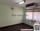 Spacious empty bedroom with air conditioner and large window
