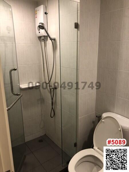 Compact and clean bathroom with shower and toilet
