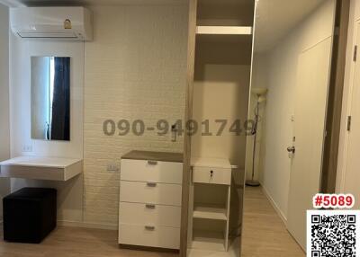 Compact bedroom with built-in wardrobe and vanity area