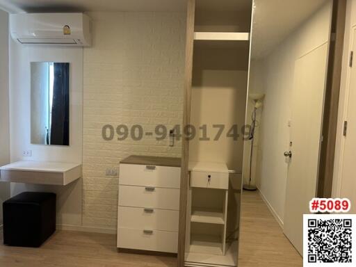 Compact bedroom with built-in wardrobe and vanity area