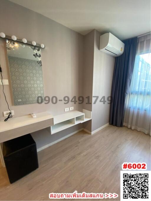 Modern bedroom with makeup vanity and large mirror