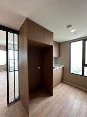 Modern bedroom with large windows and built-in wardrobe