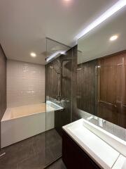 Modern bathroom with bathtub and glass shower