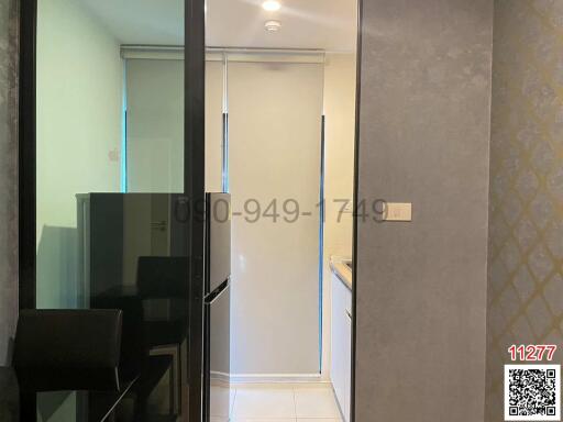 Hallway interior with reflective wardrobe and minimalist decor