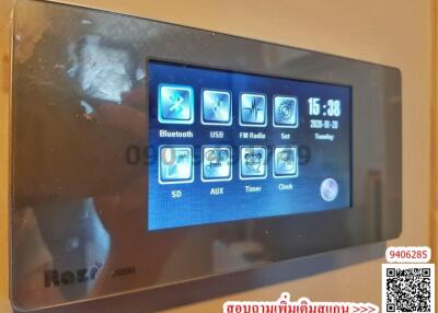 Modern wall-mounted control panel with various functions including Bluetooth, USB, FM Radio, and more