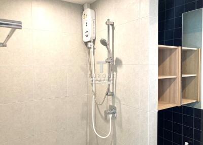 Modern bathroom with wall-mounted water heater and wooden shelves