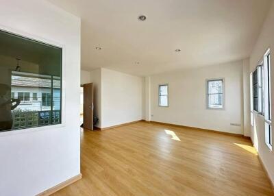 Spacious and bright living room with hardwood floors