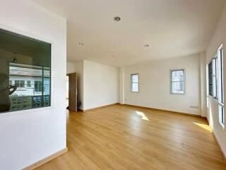 Spacious and bright living room with hardwood floors