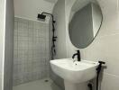 Modern compact bathroom with shower and wall-mounted sink