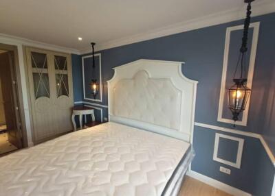 Elegant bedroom with stylish decor and modern lighting
