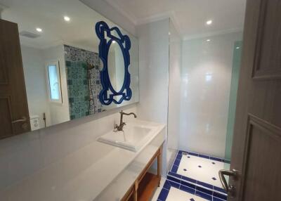 Elegant bathroom with decorative tiles and stylish mirror