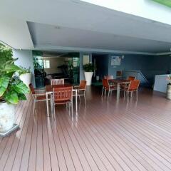 Spacious covered patio area with seating and modern amenities